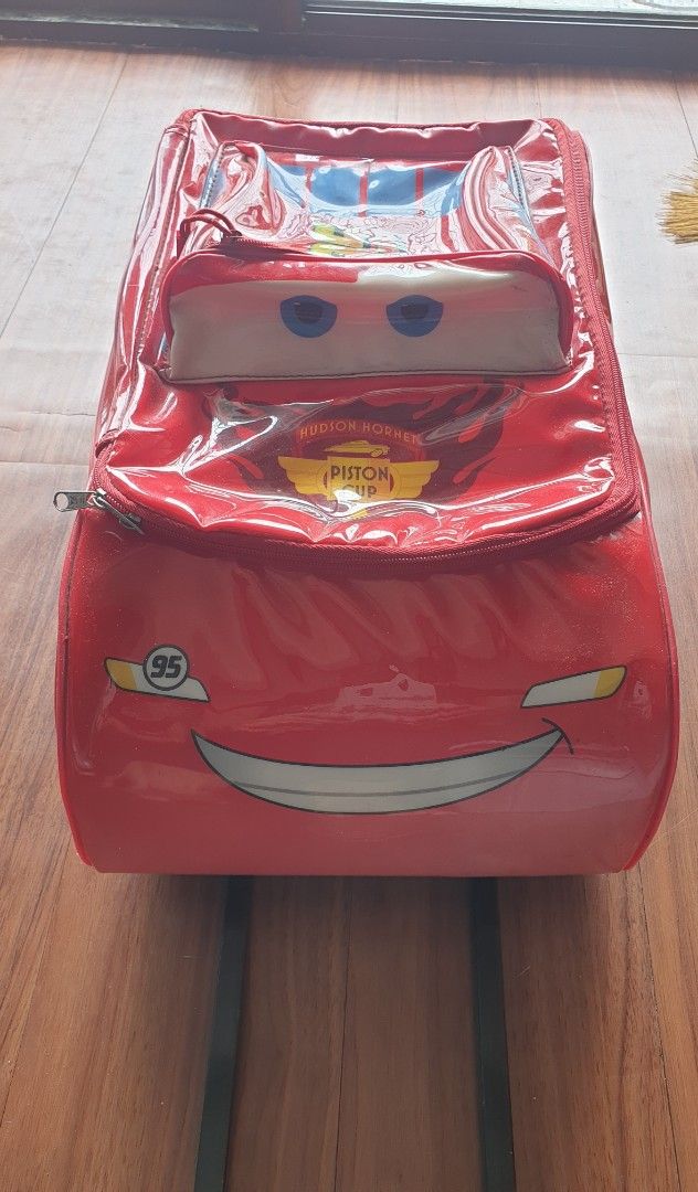 Lightning McQueen Luggage for Kids (Category: Luggage) located in Manila. Submitted by au0801 (Listing ID 1383564544, Image 1). Description: Lightning McQueen Luggage for Kids Measurement : 16"L x 13"W x 4"H With 4 wheels all in working condition With signs of usage and discoloration . Zipper is good..