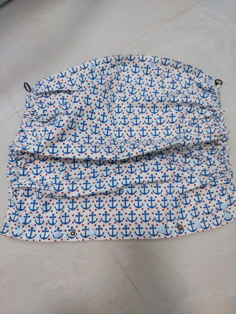 Tula Hood Cover (Category: Carriers & Slings) located in Singapore. Submitted by candy_lollipop (Listing ID 1383502469, Image 1). Description: - Features two fun prints: anchors and cartoon characters - Reversible - Brand new condition - Comfortable and stylish - Elastic band.