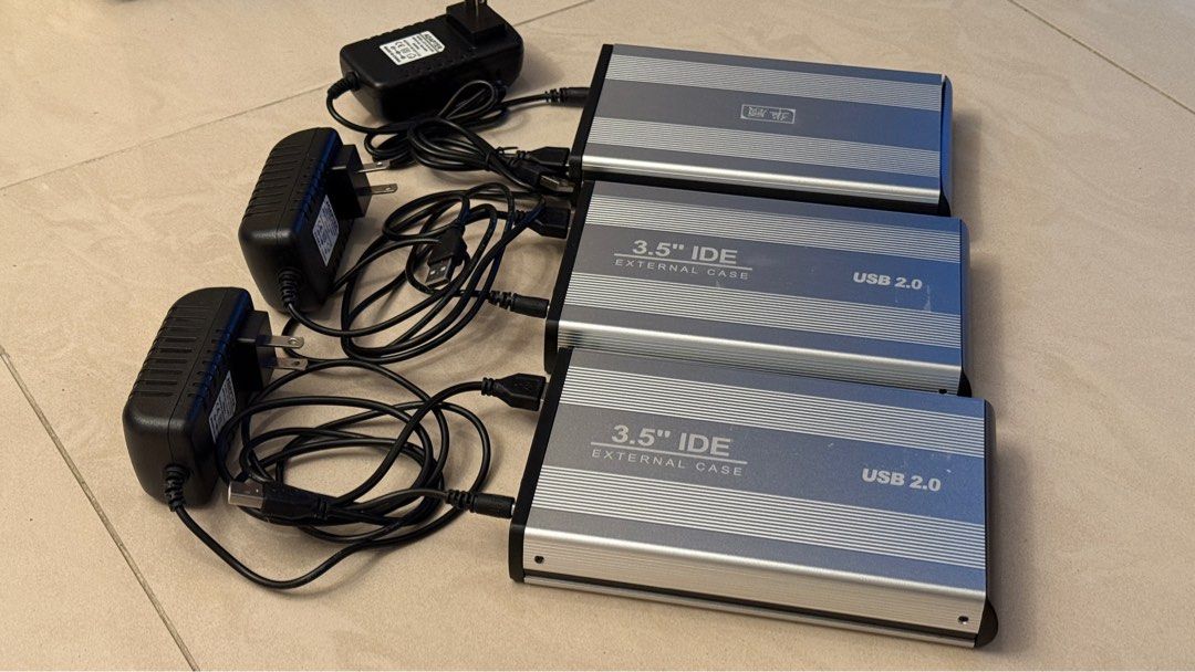 3.5" IDE External Hard Drive Enclosure USB 2.0 (Category: Hard Disks & Thumbdrives) located in Singapore. Submitted by ttjohn (Listing ID 1378447119, Image 3). Description: Selling three 3.5" IDE external hard drive enclosures. They are USB 2.0 compatible and come with power adapters and USB cables. Perfect for repurposing old IDE hard drives. All enclosures are tested and working..