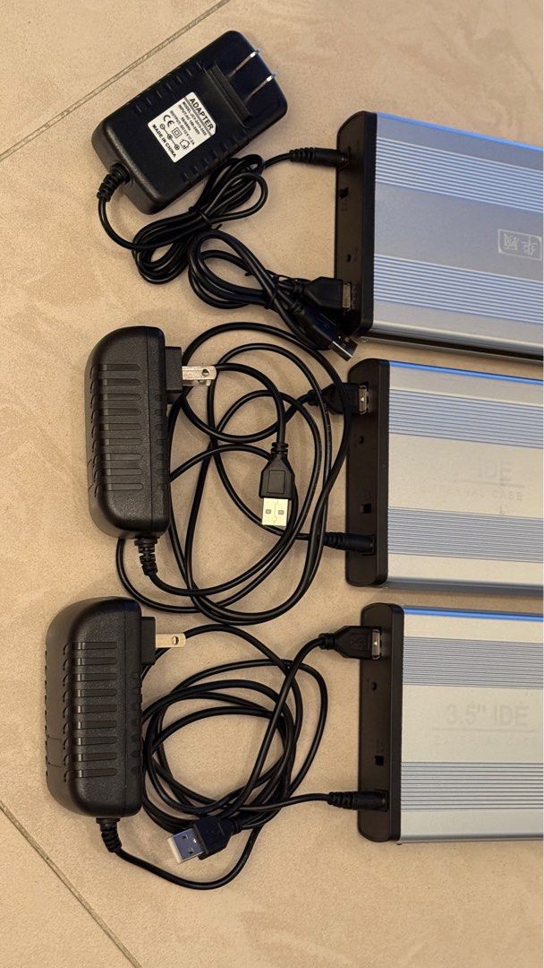 3.5" IDE External Hard Drive Enclosure USB 2.0 (Category: Hard Disks & Thumbdrives) located in Singapore. Submitted by ttjohn (Listing ID 1378447119, Image 2). Description: Selling three 3.5" IDE external hard drive enclosures. They are USB 2.0 compatible and come with power adapters and USB cables. Perfect for repurposing old IDE hard drives. All enclosures are tested and working..