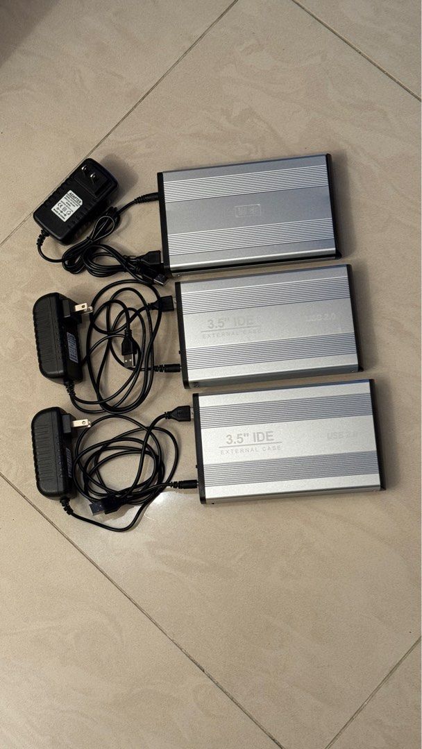 3.5" IDE External Hard Drive Enclosure USB 2.0 (Category: Hard Disks & Thumbdrives) located in Singapore. Submitted by ttjohn (Listing ID 1378447119, Image 1). Description: Selling three 3.5" IDE external hard drive enclosures. They are USB 2.0 compatible and come with power adapters and USB cables. Perfect for repurposing old IDE hard drives. All enclosures are tested and working..