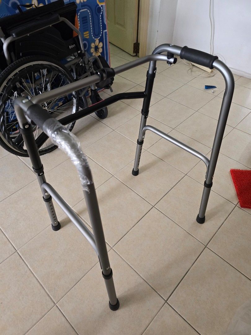 Adjustable Walking frame (Category: Other Assistive Aids) located in Singapore. Submitted by gudetamatamaa (Listing ID 1378368657, Image 2). Description: Self collection at Boon lay only. - Adjustable walker in good condition - Sturdy and reliable design - Features adjustable height settings - Comfortable hand grips for ease of use - Provides mobility assistance - Please view photos for details.