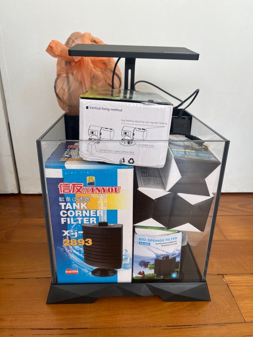 Aquarium Starter Kit - Smart Feeder, Light, Filter, Tank (Category: Homes & Other Pet Accessories) located in Singapore. Submitted by francescahp (Listing ID 1378420765, Image 1). Description: Complete aquarium starter kit. Includes a Smart Feeder AF-2019B, LED light, tank, filter, and filter media. Perfect for beginners. All items are brand new or like new condition. Ready to set up your new aquarium!.