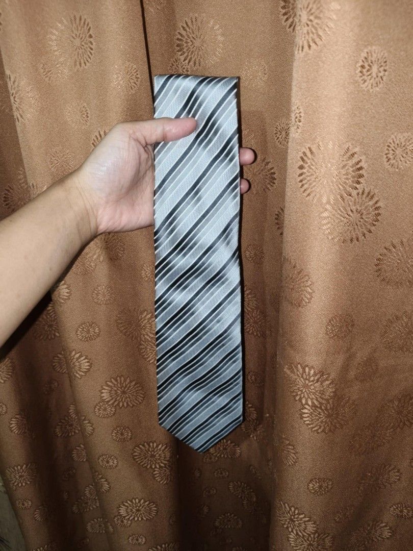 Armando Caruso Silver and Black Neck Tie (Category: Ties) located in Quezon City. Submitted by drlnmrdn (Listing ID 1378458834, Image 1). Description: Armando Caruso Silver and Black Neck Tie PHP 300 - Barely used - No issues with the clothing at all. Pick-Up only or Pick-Up by your rider. Buyer should book the delivery so they can monitor the delivery. Meet-up on Ever Gotesco Commonwealth, SM Fairview or, SM North only. MOP: Cash on Pickup, bank