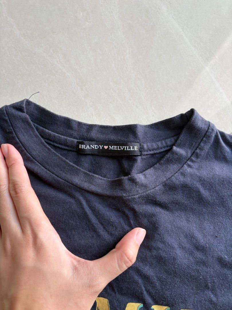 Brandy Melville Wyoming Crop Top (Category: Shirts) located in Singapore. Submitted by wooperbooper (Listing ID 1378434770, Image 2). Description: unsure of authenticity length 40cm ptp 44cm.