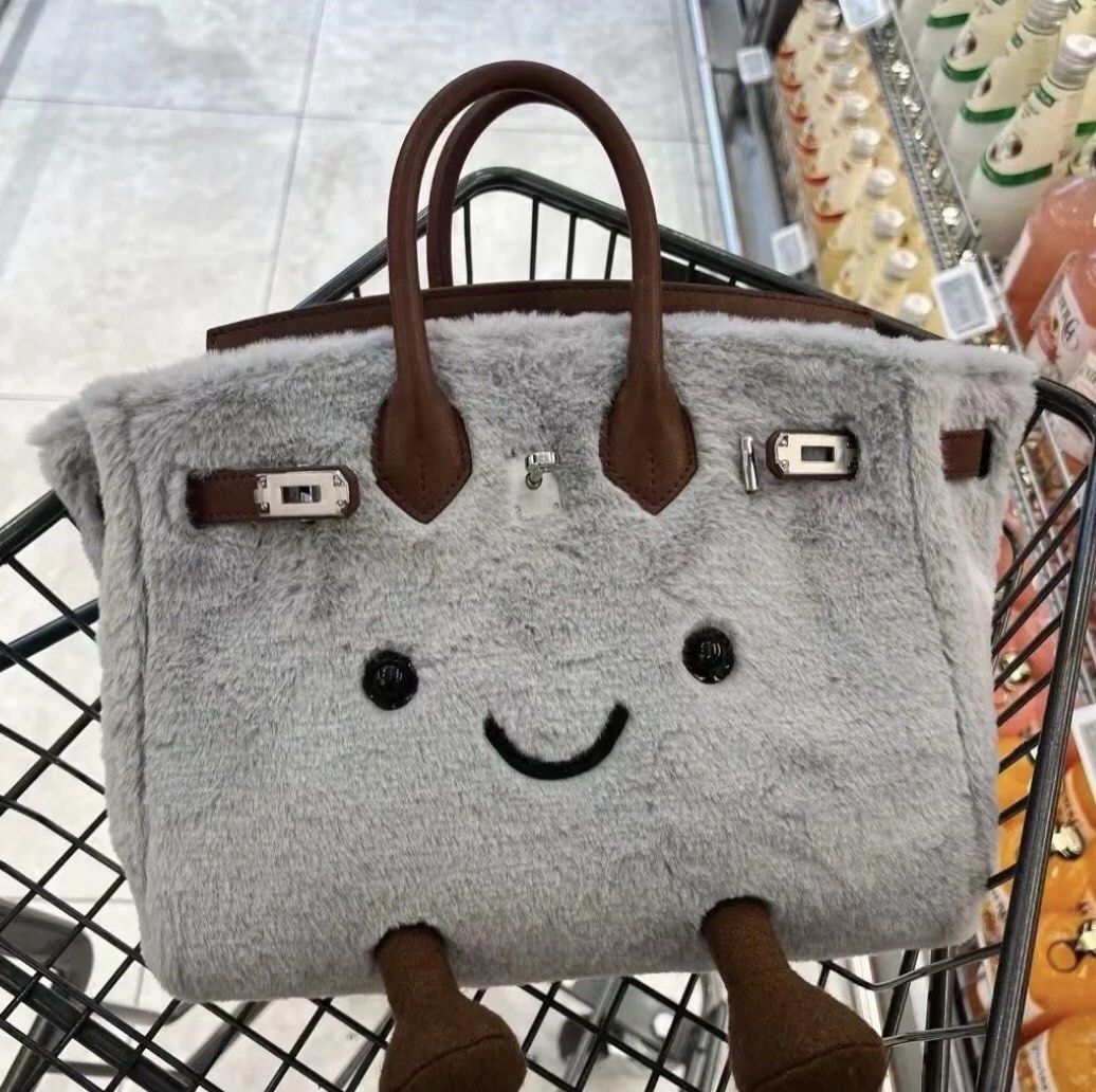 Cute Plush Handbag with Smiling Face (Category: Shoulder Bags) located in Singapore. Submitted by steinwaykid (Listing ID 1378352491, Image 1). Description: Adorable plush handbag with a smiling face. Features brown handles and feet, and silver-colored clasps. Perfect for carrying small items or as a unique decorative piece. Great gift idea! Jellycat inspired design. 7 to 14 days for order to be shipped. .