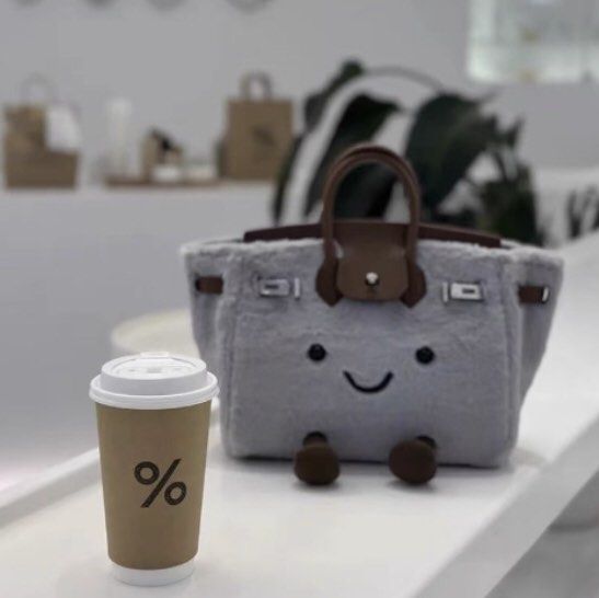 Cute Plush Handbag with Smiling Face (Category: Shoulder Bags) located in Singapore. Submitted by steinwaykid (Listing ID 1378352491, Image 2). Description: Adorable plush handbag with a smiling face. Features brown handles and feet, and silver-colored clasps. Perfect for carrying small items or as a unique decorative piece. Great gift idea! Jellycat inspired design. 7 to 14 days for order to be shipped. .