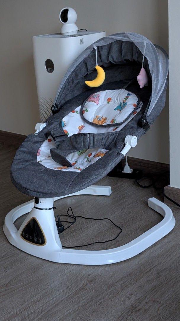 Electric Baby Swing with Remote Control (Category: Infant Playtime) located in Singapore. Submitted by charlottemarket (Listing ID 1378432992, Image 1). Description: - Gently used electric baby swing - Includes remote control - Includes hanging toy and canopy - Multiple music options - Adjustable swing speeds - Perfect for soothing your baby - Bought it at $60 since 21 June 2025, so relatively new. - Used only four times. - Selling because we got