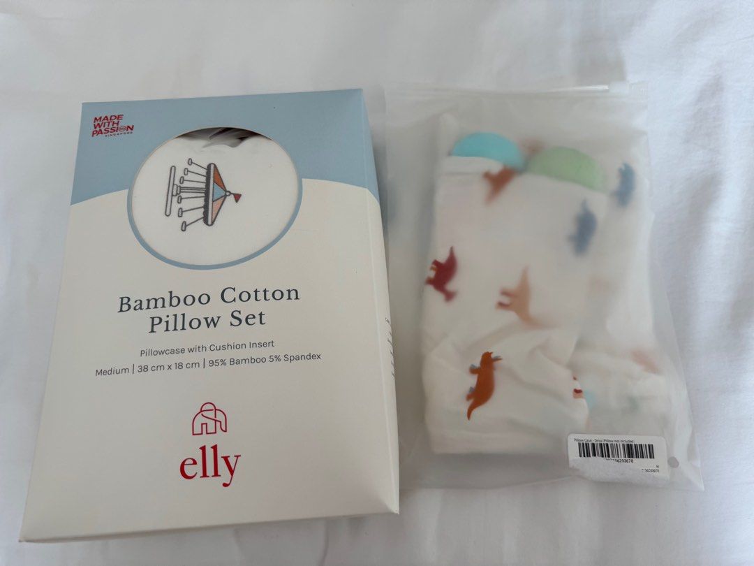 Elly Bamboo Cotton Pillow Set (Category: Childrens' Beds) located in Singapore. Submitted by llama2 (Listing ID 1378352887, Image 1). Description: Brand new Elly Bamboo Cotton Pillow Set in Theme Park design. Includes pillowcase with cushion insert. Made with soft, breathable bamboo cotton fabric. Suitable for children aged 0-14 years. Machine washable for added convenience. Never used, still in original packaging. Additional dinosaur pillow cove
