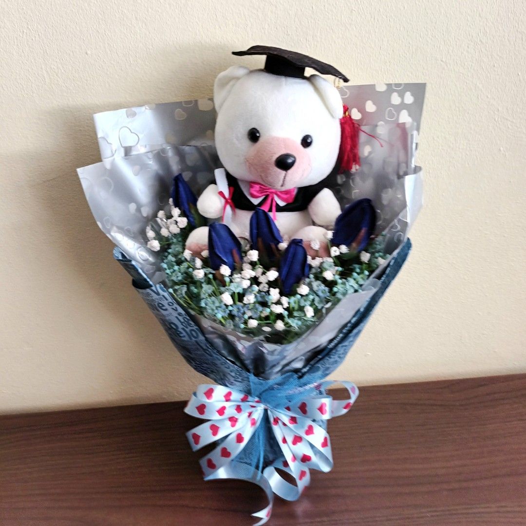 Graduation Bouquet-20cm Graduation Bear + Blue Roses + White & Blue Baby Breath (Category: Flowers & Bouquets) located in Singapore. Submitted by ManyThingsUC (Listing ID 1378428437, Image 2). Description: Height:45cmx Width 30cm 20cm Graduation Bear With Artificial Blue Velvet Roses +White & Blue Silk Baby Breath..