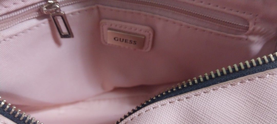 Guess sling bag (Category: Shoulder Bags) located in Cavite. Submitted by japkor2026 (Listing ID 1378479715, Image 3). Description: Guess sling bag good as new no issue.