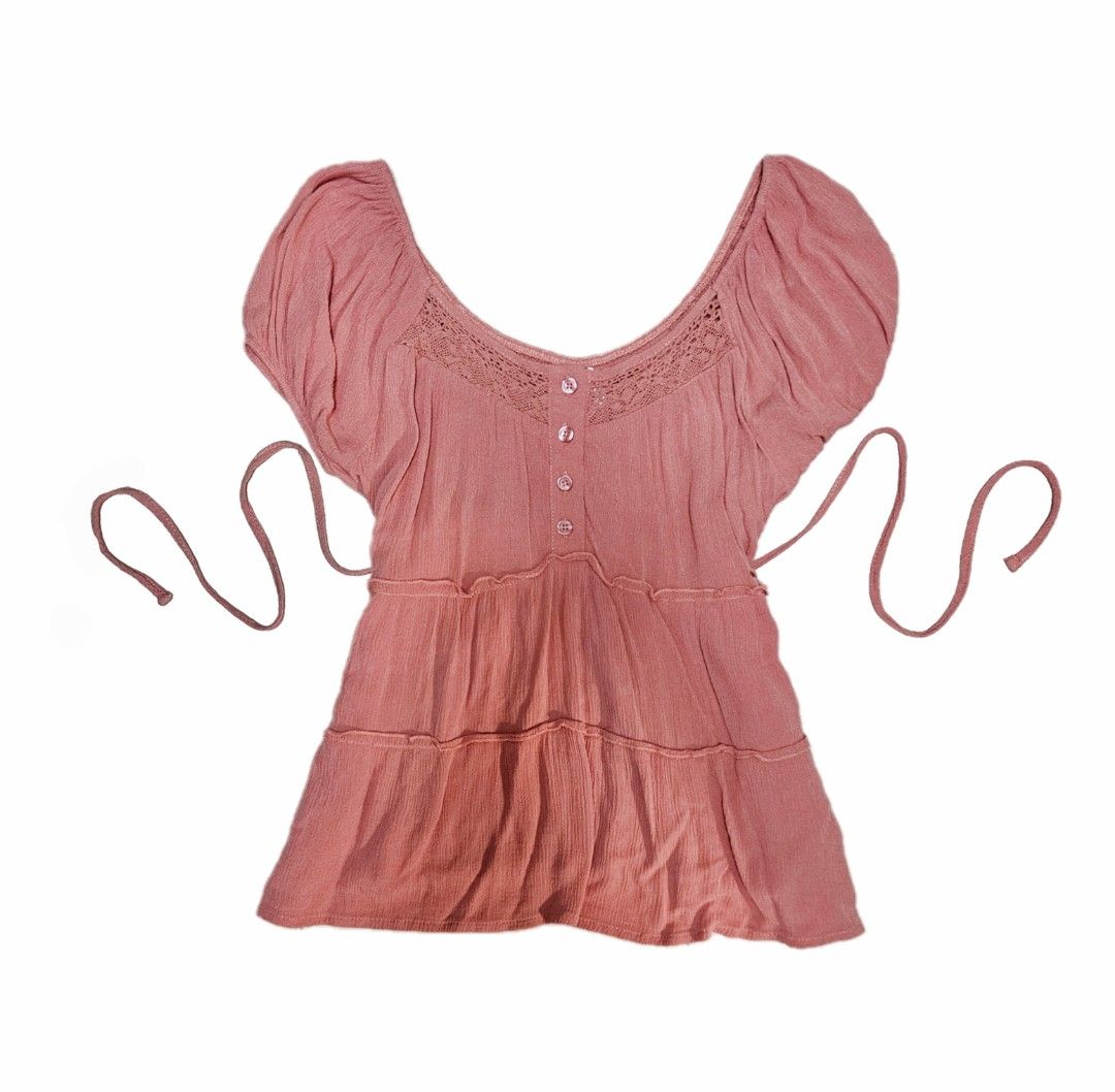JP Thrifted Coral Pink Babydoll Top with ribbon (Cottagecore/Coquette/Shoujo) (Category: Blouses) located in Singapore. Submitted by thriftedjapanclothesclearance (Listing ID 1378449621, Image 1). Description: Ptp: ~40 cm (Very soft and stretchy) Length: 60 cm | Size:Fits up till L Description: * Cute little coral pink top with cinch tie! The material is really soft and flowy, and the texture adds so much daintiness to it <33 * Definetly a perfec