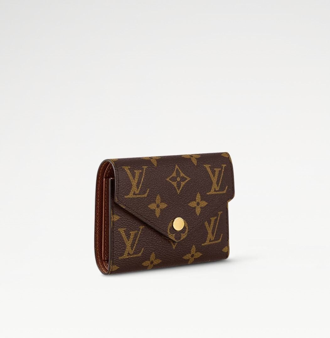 Louis Vuitton Victorine Wallet (Monogram) (Category: Luxury Bags & Wallets) located in Manila. Submitted by loverose7 (Listing ID 1378465628, Image 2). Description: ✨ Pre-Loved & Authentic! ✨ 🤎 Louis Vuitton Victorine Wallet – M62472 (Monogram) ✅ 100% Original | Purchased in Singapore 🎁 Comes with Box & Dust Bag The compact Victorine wallet in Monogram canvas combines femininity and functionality. It opens out to reveal many practical features,