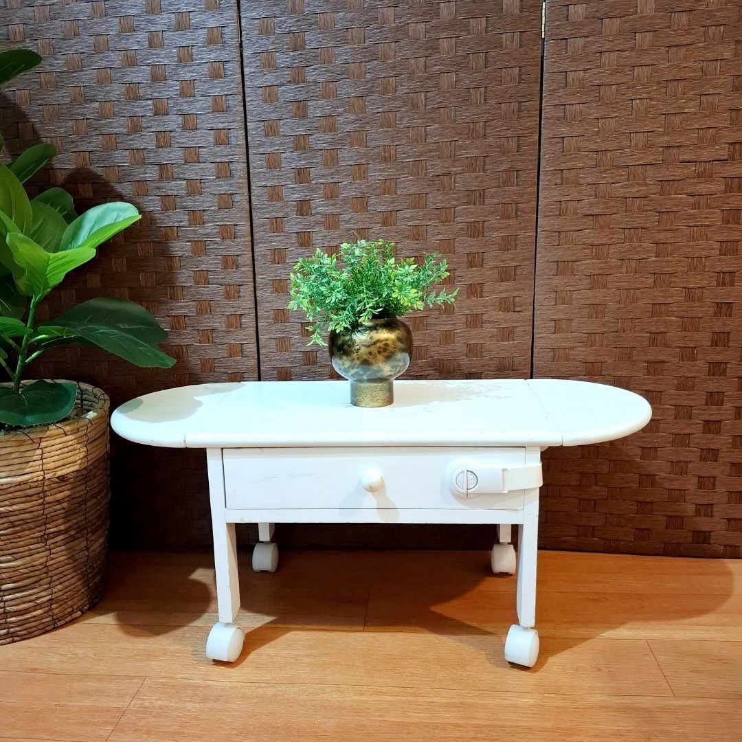 Mini drop leaf laptop table desk solid wood with drawer (Category: Tables & Sets) located in Dasmarinas. Submitted by millennialmeetsvintage (Listing ID 1378251551, Image 2). Description: H 31 x L 45-73 x W 28 cm solid wood sturdy and durable movable, with 4 wheels needs repaint last price posted 📌shipping via lalamove only 📌no reservations, first-to-pay basis 📌no physical store, no walk-ins 📌ships from dasma cavite 📌no COD transactions.
