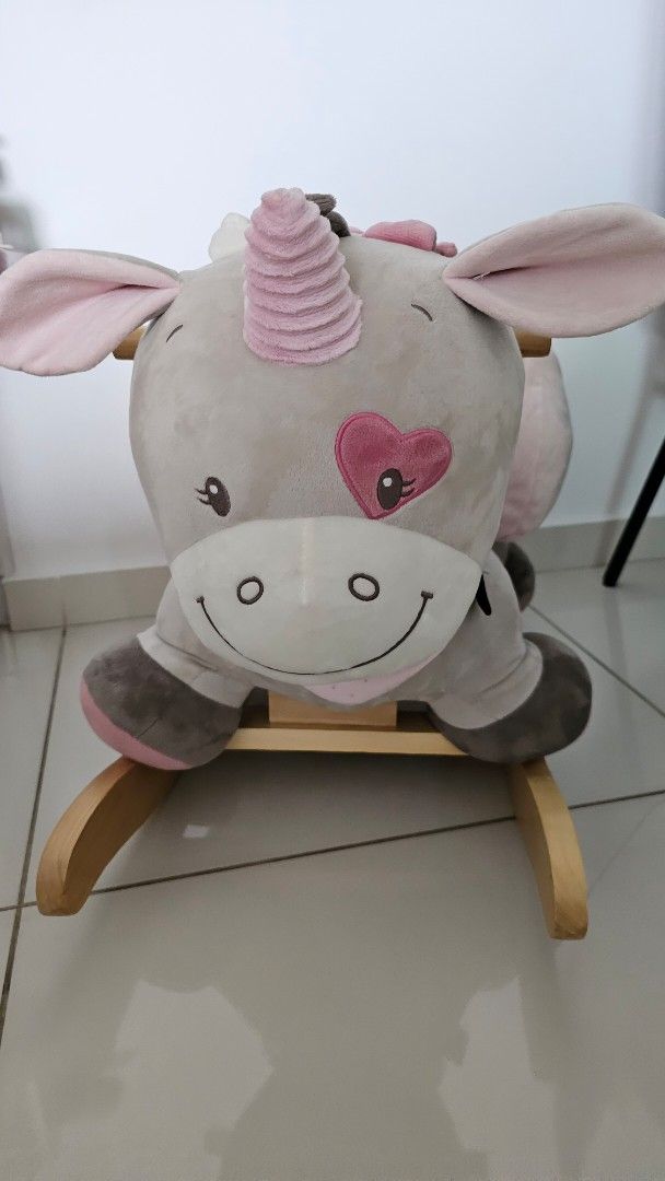 Nattou Rocker Jade The Unicorn (baby rocker) (Category: Infant Playtime) located in Singapore. Submitted by rawkaholic (Listing ID 1378396829, Image 1). Description: - Adorable Nattou Jade the Unicorn Rocker - Suitable from 10-36m - Made with soft, plush material - Features a sturdy wooden base - Excellent condition - Encourages imaginative play - Helps develop balance - Original price: $259.00.