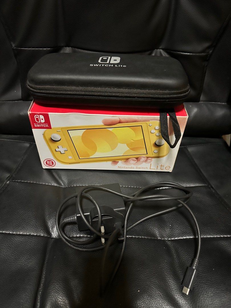 Nintendo switch lite yellow (Category: Nintendo) located in Quezon City. Submitted by oohsahanuhh (Listing ID 1378496743, Image 2). Description: Bought from hongkong With box With original charger Lady owned With travel case With analog caps (animal crossing) With turquoise silicon protection case Meet up only SM NORTH or TRINOMA payment cash, gcash or BDO .