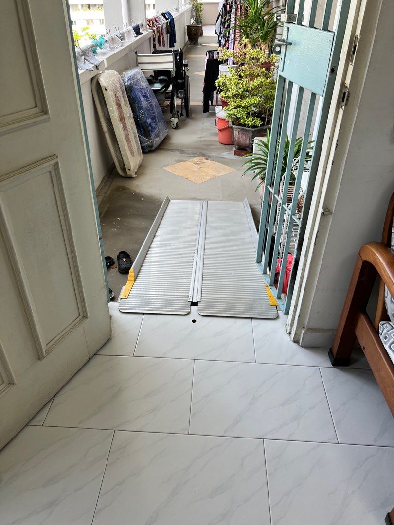 Portable Wheelchair Ramp (Category: Wheelchairs) located in Singapore. Submitted by tchunt (Listing ID 1378453511, Image 1). Description: Light and bi-fold aluminium ramp. Sturdy and light and mobile. .
