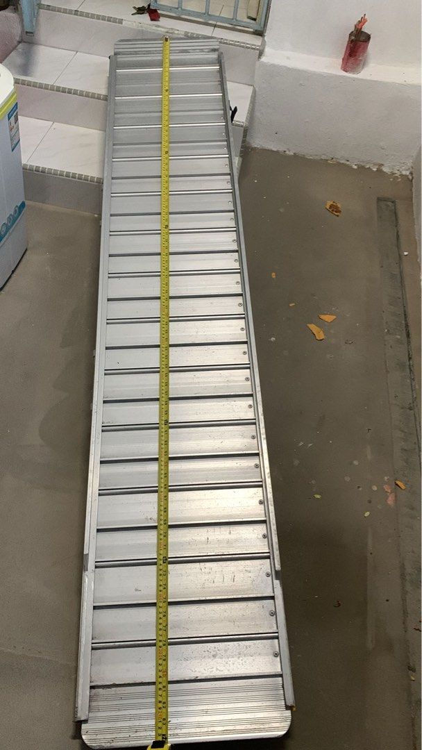 Portable Wheelchair Ramp (Category: Wheelchairs) located in Singapore. Submitted by tchunt (Listing ID 1378453511, Image 2). Description: Light and bi-fold aluminium ramp. Sturdy and light and mobile. .