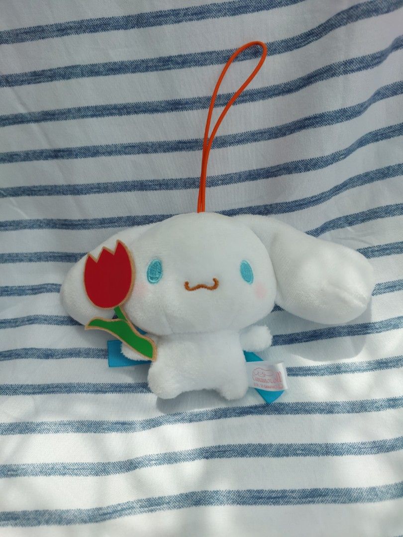 Sanrio Cinnamoroll Red Tulip plush charm (Category: Plushies & Soft Toys) located in Baguio. Submitted by tinkerjoystudio (Listing ID 1378512009, Image 1). Description: ✨️details: ♡ Original 2021 Sanrio tush tag (etiketa) intact ♡ no flaws, no discolorations, super clean! ♡ elastic strap type ♡ with pretty blue ribbon at back ♡ actual color may vary due to lighting ♡ be a responsible buyer.