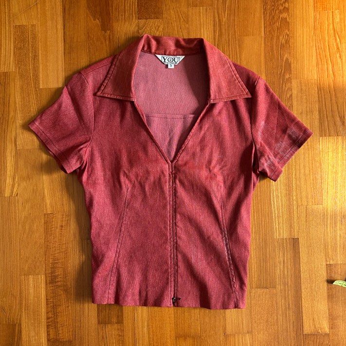 thrifted vintage y2k collared red corset longline blouse (Category: Blouses) located in Singapore. Submitted by carvedwaves (Listing ID 1378362643, Image 1). Description: MAILING OR SELF COLLECTION ONLY thrifted a while back, has some mild discolouration on the front that makes it look slightly acid washed - not for fussy buyers. super flattering fit bc of the darts, colour most accurate to first picture .