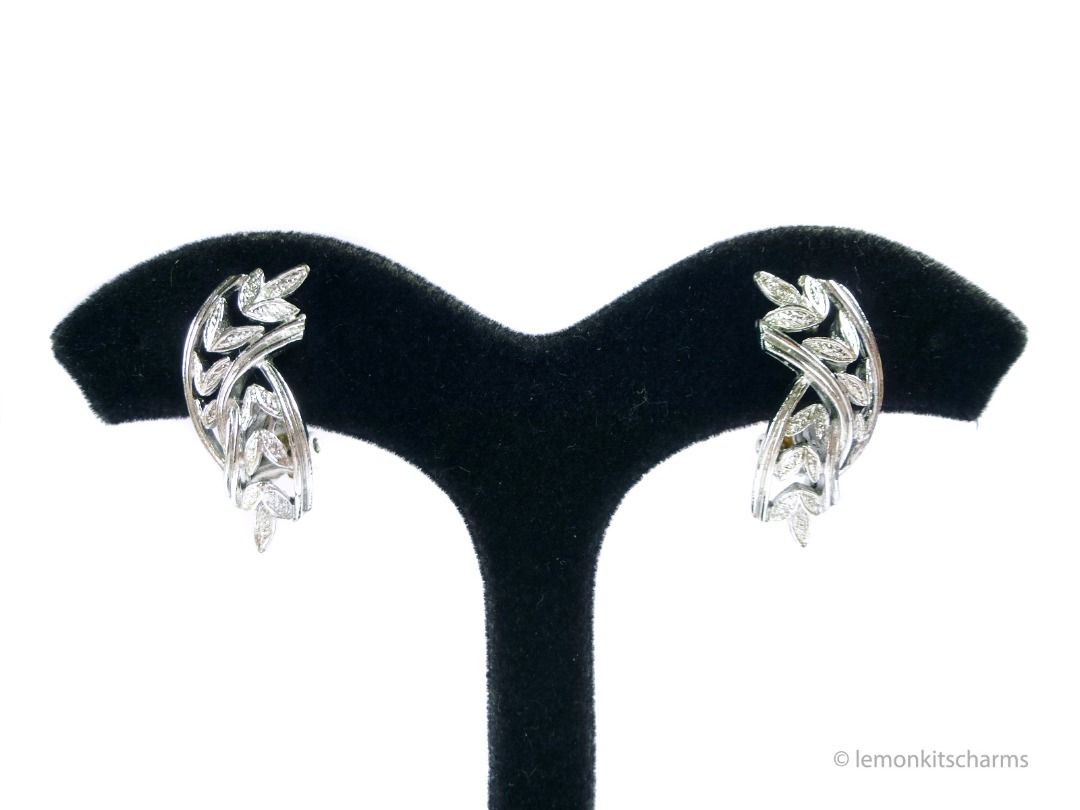 Vintage 1950s Coro Silvertone Leaves Clip Earrings, er2670-ci (Category: Earrings) located in Singapore. Submitted by lemonkitscharms (Listing ID 1378458047, Image 2). Description: Vintage 1950s - 1960s Coro Silvertone Leaves Clip Earrings. Signed '©Coro'. Excellent vintage condition. Double curved pattern with leaves. Price excludes postage. Check my profile for postage rates. Size: 28 x 11mm - Sorry NO NEGO for 1 item. Buy 4 or more other items