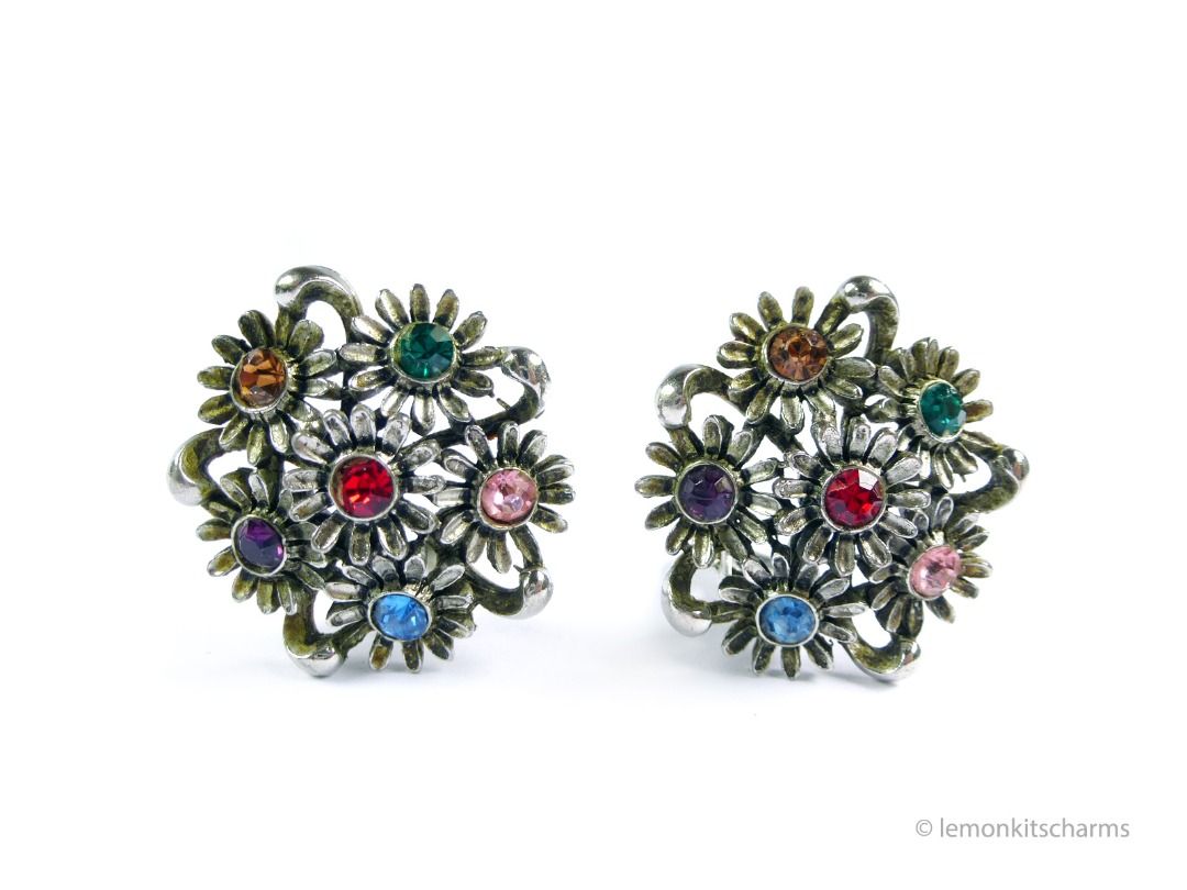 Vintage 1950s Judy Lee Floral Cluster Clip Earrings, er2671-ci (Category: Earrings) located in Singapore. Submitted by lemonkitscharms (Listing ID 1378458514, Image 1). Description: Vintage 1950s Judy Lee Floral Cluster Earrings, clip on style. Signed 'Judy Lee' and 'PAT.PEND.' on clips. Very good vintage condition, minor aging and wear. Antiqued-silvertone plating with a cluster of flowers and mixed coloured rhinestones. Price excludes postage. 