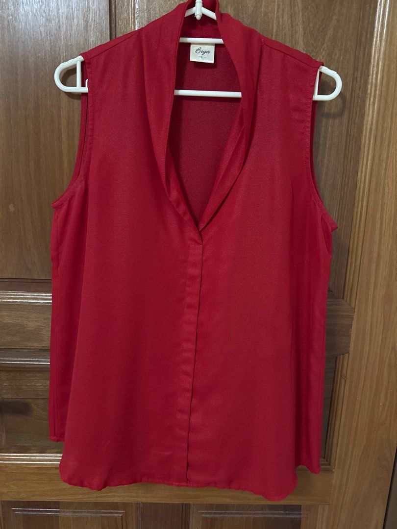 Vintage Red Sleeveless Blouse (Category: Blouses) located in Singapore. Submitted by sweet_dreamer (Listing ID 1378457271, Image 1). Description: This vintage red sleeveless blouse features a unique collar design and button-up front. The blouse is in good condition, with no visible flaws. Perfect for a retro look or adding a pop of color to your wardrobe..