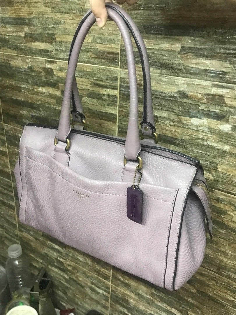 Authentic Coach Lilac Leather Boston Bag (Category: Luxury Bags & Wallets) located in Manila. Submitted by kaloyyyyyy (Listing ID 1383837149, Image 2). Description: Now you can carry your everyday essentials in a chic look with this bag from the house of Coach. Designed to impart a look of luxurious style, this Boston bag is a great way to accessorize your casual ensembles to bring about a trendy twist that imparts a graceful look. Gender :Women 