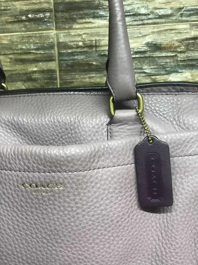 Authentic Coach Lilac Leather Boston Bag (Category: Luxury Bags & Wallets) located in Manila. Submitted by kaloyyyyyy (Listing ID 1383837149, Image 3). Description: Now you can carry your everyday essentials in a chic look with this bag from the house of Coach. Designed to impart a look of luxurious style, this Boston bag is a great way to accessorize your casual ensembles to bring about a trendy twist that imparts a graceful look. Gender :Women 