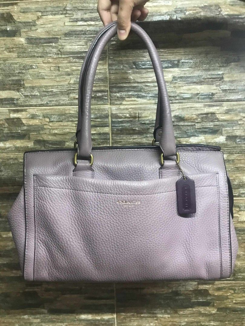 Authentic Coach Lilac Leather Boston Bag (Category: Luxury Bags & Wallets) located in Manila. Submitted by kaloyyyyyy (Listing ID 1383837149, Image 1). Description: Now you can carry your everyday essentials in a chic look with this bag from the house of Coach. Designed to impart a look of luxurious style, this Boston bag is a great way to accessorize your casual ensembles to bring about a trendy twist that imparts a graceful look. Gender :Women 