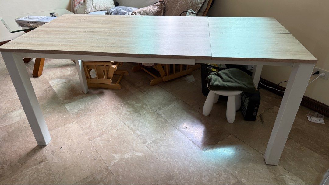 Expandable Dining Table (Category: Tables & Sets) located in Manila. Submitted by bmarie26 (Listing ID 1383728682, Image 2). Description: Expandable Dining Table for Sale. 120x80cm, can extend to 170cmx80cm. From Victoria Mondiale, original price 16k or higher. Sturdy metal legs. With some small chips and small gap on the edges, does not affect function and will not be visible if you use a table cloth. Can send more photos. Selling low because of
