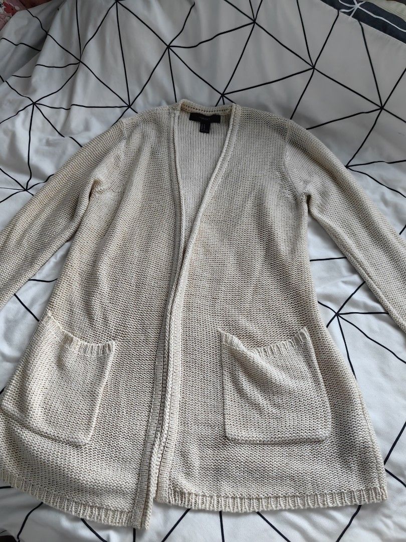Forever 21 white knitted cardigan (Category: Others Tops) located in Manila. Submitted by sasaweee (Listing ID 1383780958, Image 2). Description: -Small to large frame - perfect for beach ootd -rfs: decluttering.