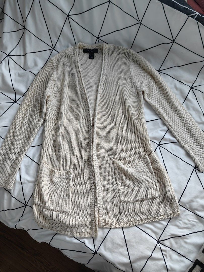 Forever 21 white knitted cardigan (Category: Others Tops) located in Manila. Submitted by sasaweee (Listing ID 1383780958, Image 1). Description: -Small to large frame - perfect for beach ootd -rfs: decluttering.