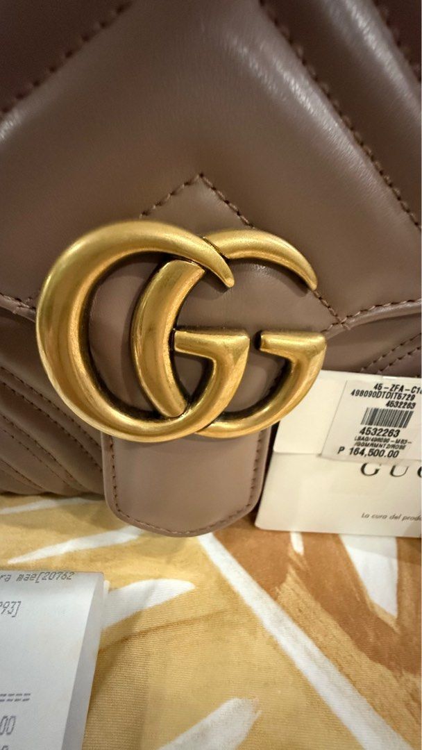 Gucci Marmont top handle bag small size (Category: Luxury Bags & Wallets) located in Manila. Submitted by luckyrabbit_8df186 (Listing ID 1383809214, Image 3). Description: Small marmont top handle bag in Dusty Pink like new condition. Bought in Rustans Shangrila Complete With receipt, care card.