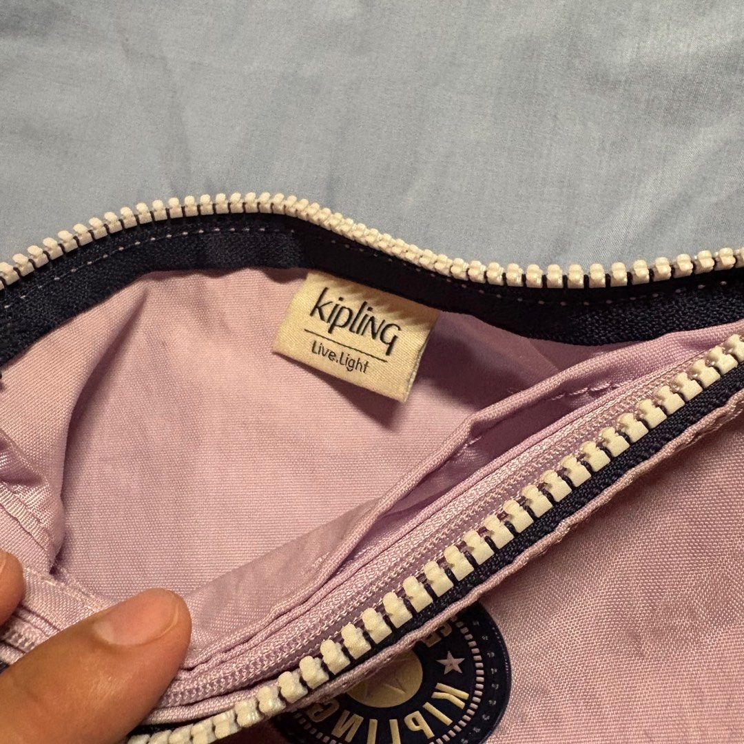 KIPLING Creativity L Gentle Lilac (Category: Purses & Pouches) located in Manila. Submitted by mdc08 (Listing ID 1383776465, Image 2). Description: **Rarely used item as I have a lot of pouches 😊** Meet your new favourite go-to pouch by KIPLING : The Creativity. This large multi-use pouch features a zipped main compartment and three inside pockets, so you can easily store and organise your keys, coins, money, make-up and other daily essentials. 