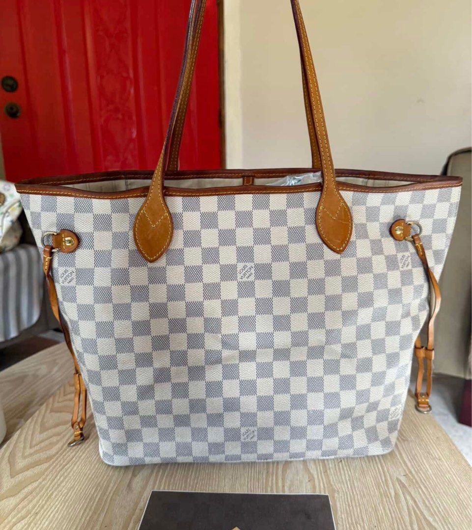 LV neverfull Damier Azur Canvas MM (Category: Luxury Bags & Wallets) located in Manila. Submitted by amari_ry19 (Listing ID 1383844619, Image 1). Description: Authentic. My prelove bag. Fixed price. All photos posted for authenticity Has Authenticity certificate Checked with Luxury bag cleaning (Prime Restore Manila) and its priced + 3500 additional Can be shipped via lalamove from Manila.