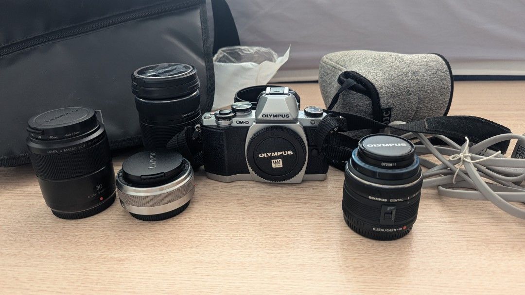 Olympus OMD E-M10 Mk1 micro four thirds camera + 4 lens bundle (Category: Cameras) located in Quezon City. Submitted by cescpistol (Listing ID 1383741965, Image 1). Description: For sale: Olympus OMD E-M10 Mark I with four lenses 1. Olympus 14-42mm kit lens 2. Panasonic 20mm F1.7 ii 3. Panasonic Macro G 30mm 4. Olympus 40-150mm telephoto zoom The two Panasonic lenses sell for over $200 each on the used market, so you're basically getting the tele