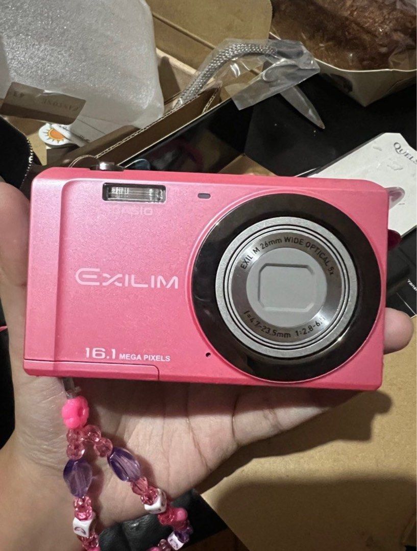Pink Casio Digicam (Category: Cameras) located in Cabuyao City. Submitted by adelaideee_ (Listing ID 1383853892, Image 2). Description: No issue at all Mint condition DM me for sample pics Complete with box, charger and SD card .