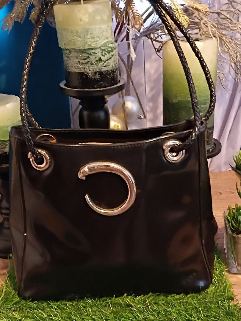 Cartier vintage shoulder bag (Category: Luxury Bags & Wallets) located in San Juan City. Submitted by cheryl20624 (Listing ID 1383984676, Image 1). Description: Preloved cartier vintage Polished leather panther hand bag /shoulder bag silver hardware japan source.