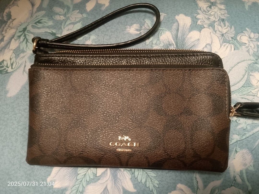 COACH Wristlet (Category: Wallets & Card holders) located in Tagum. Submitted by ms.jopz (Listing ID 1383999328, Image 1). Description: COACH Wristlet -Original -double zip -no box, no tags, no papers -negotiable -with minor flaws MOP - GCASH MOD - J&T.