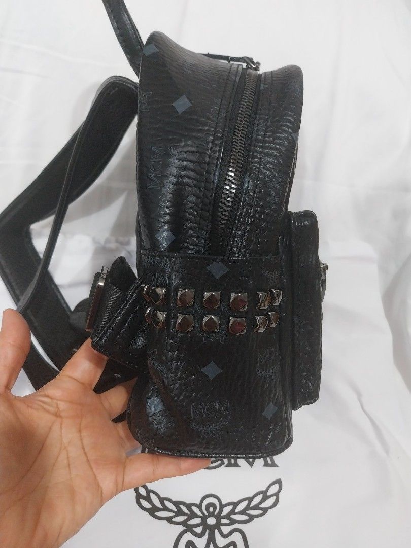 MCM Stark Side Studs (Category: Backpacks) located in Quezon City. Submitted by jonvee2000 (Listing ID 1383966271, Image 2). Description: preloved small in size turnable screw/ykk zipped.