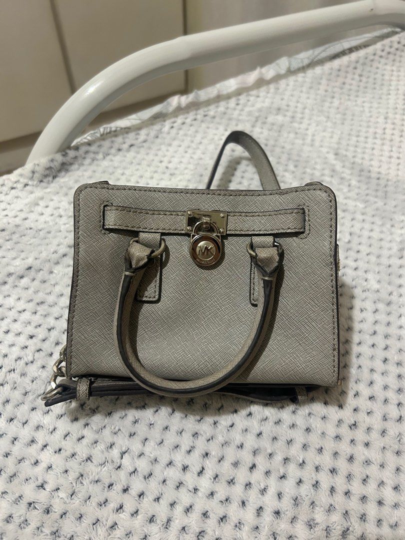 Michael Kors Hamilton mini (Category: Luxury Bags & Wallets) located in Angono. Submitted by kkuroset (Listing ID 1384006059, Image 1). Description: Original no major flaws other than the rubbed handle (2nd and 3rd pic) which is unnoticeable naman since nakababa lagi handle needs little cleaning lang but still good condi.