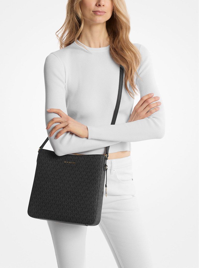 Michael Kors Jet Set Large Messenger Bag (Category: Luxury Bags & Wallets) located in Taguig. Submitted by blissdreana (Listing ID 1384024170, Image 1). Description: Michael Kors Jet Set Large Messenger Bag Crafted from coated canvas and printed with MK iconic initials , the Jet Set Travel messenger offers a timeless approach to accessorizing. The sleek silhouette fastens with a top-zip opening, while the adjustable shoulder strap promises a perf