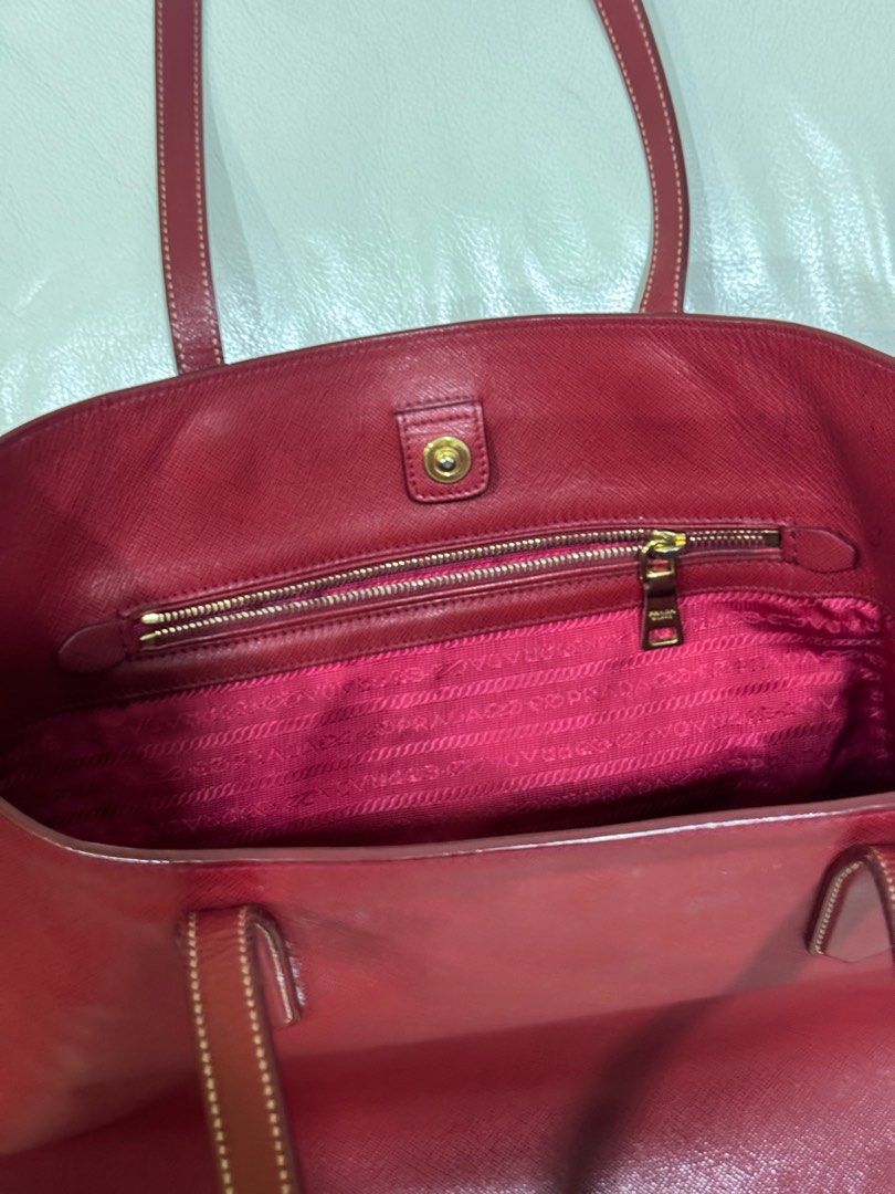 Prada Saffiano Shopping Tote in red (Category: Luxury Bags & Wallets) located in Paranaque City. Submitted by plaidgreen (Listing ID 1383868397, Image 3). Description: .