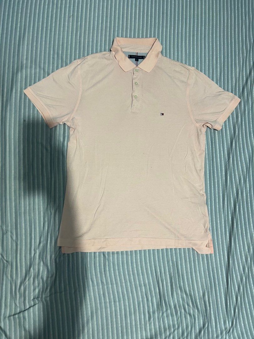 TOMMY HILFIGER (Category: Tshirts & Polo Shirts ) located in Daraga. Submitted by sudeee (Listing ID 1383987649, Image 1). Description: TOMMY HILFIGER Dimes: 22 x 28 Issue: repaired pinhole, stains (NEEDWASH) Color Rate: 9/10.
