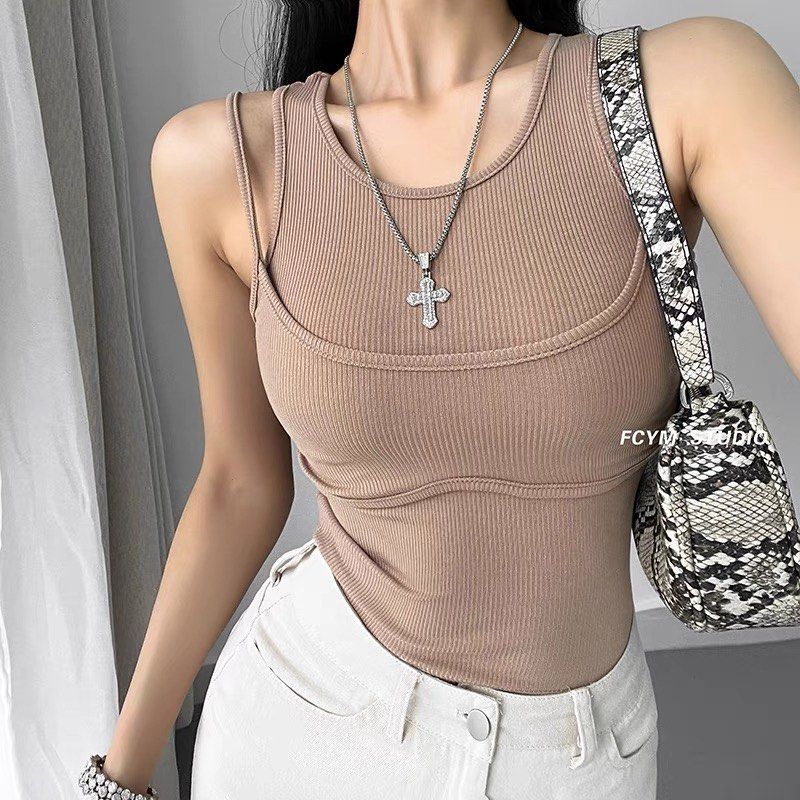 🖤 4 COLORS: y2k Double Layered Sleeveless Spag Tank Knit Top (Category: Sleeveless) located in Singapore. Submitted by nylirehswong (Listing ID 1378697013, Image 2). Description: NEW IN 🔥 Exclusively curated here! Blogshop inspired. Ft a sultry hypebeast streetstyle 2 layered spag cami top. Comfy ribbed cotton knit. Highly stretchable, non-sheer. Colours avail: 1. Classic black 2. Dark Grey 3. Sky blue 4. Classic white FREESIZE (fits XXXS-M): P