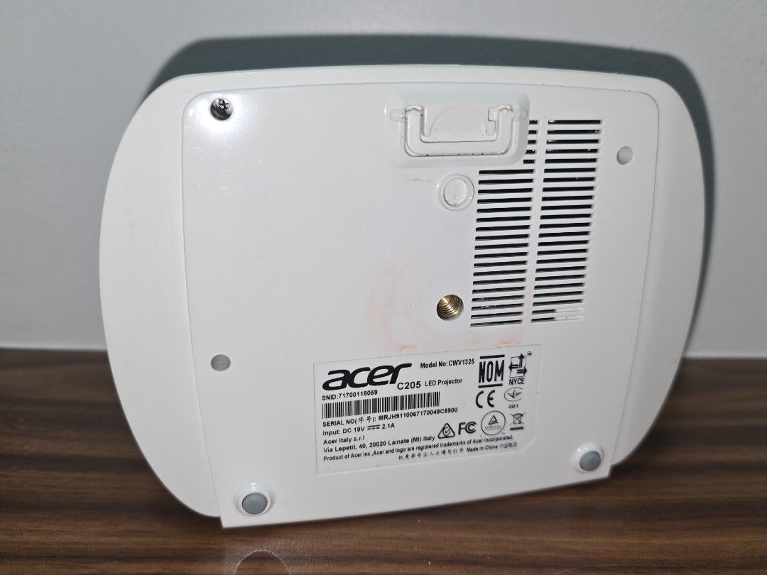 ACER MINI PROJECTOR C205 (Category: Projectors) located in Quezon City. Submitted by bravedragon.3db54d (Listing ID 1378602657, Image 2). Description: Would like to sell it since i do not know how to fix the white dots that appear on the projected image. Says in youtube that i have to replace the dmv chip, which i don'r know how to. but there might be a chance that it can be resolved by just cleaning the dmv chip as well. i'll also throw in the a