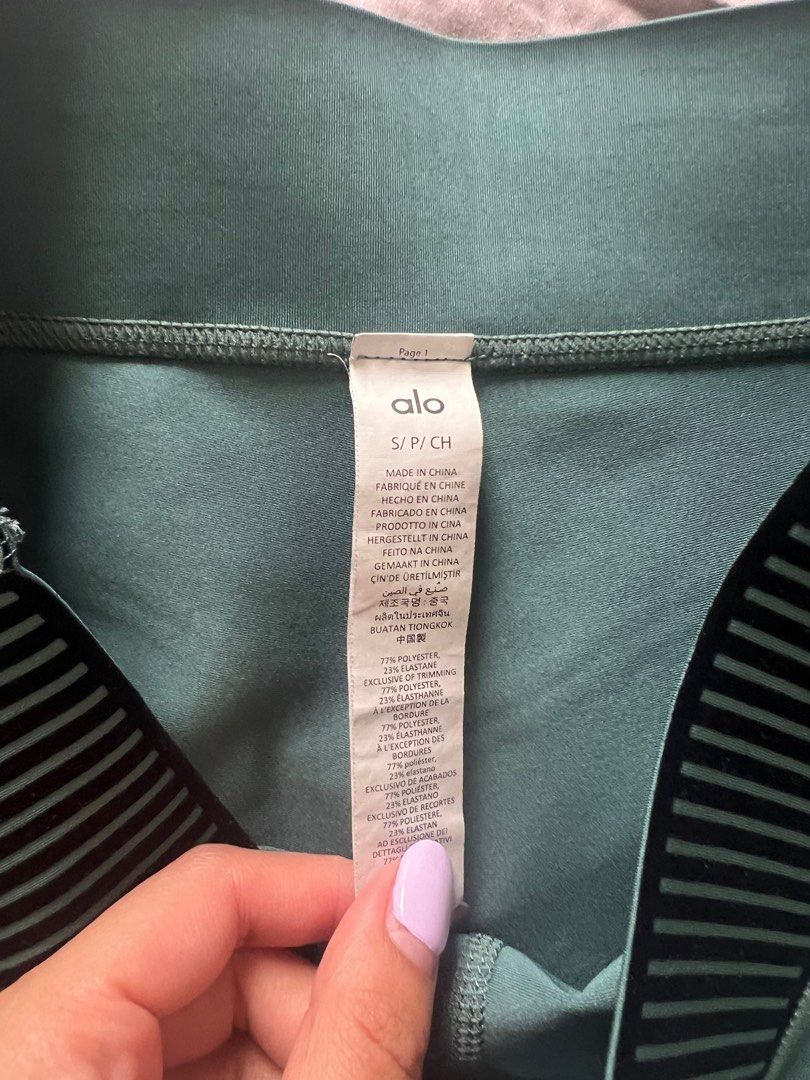 Alo Yoga High-Waist Airbrush Leggings - Size S (Category: Activewear) located in Singapore. Submitted by riyete (Listing ID 1378587228, Image 2). Description: These Alo Yoga leggings are in excellent condition. They feature a high-waist design and a flattering fit. The leggings are a beautiful green color with black stripe detailing. Perfect for yoga, workouts, or casual wear..