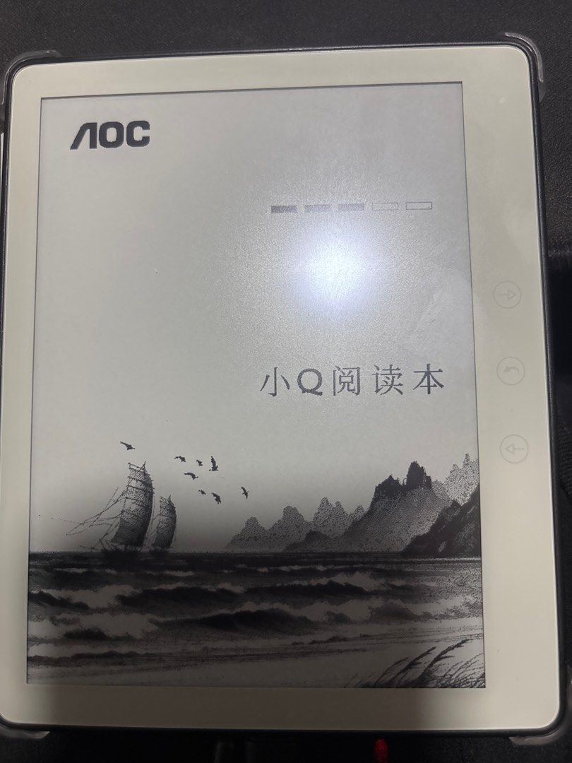 AOC E-reader (Category: E-Readers) located in Singapore. Submitted by cheny4996 (Listing ID 1378716287, Image 1). Description: AOC e-reader in good condition. The screen displays a beautiful illustration. It has a sleek design and is perfect for reading on the go. The device appears to be working well. Come with case .