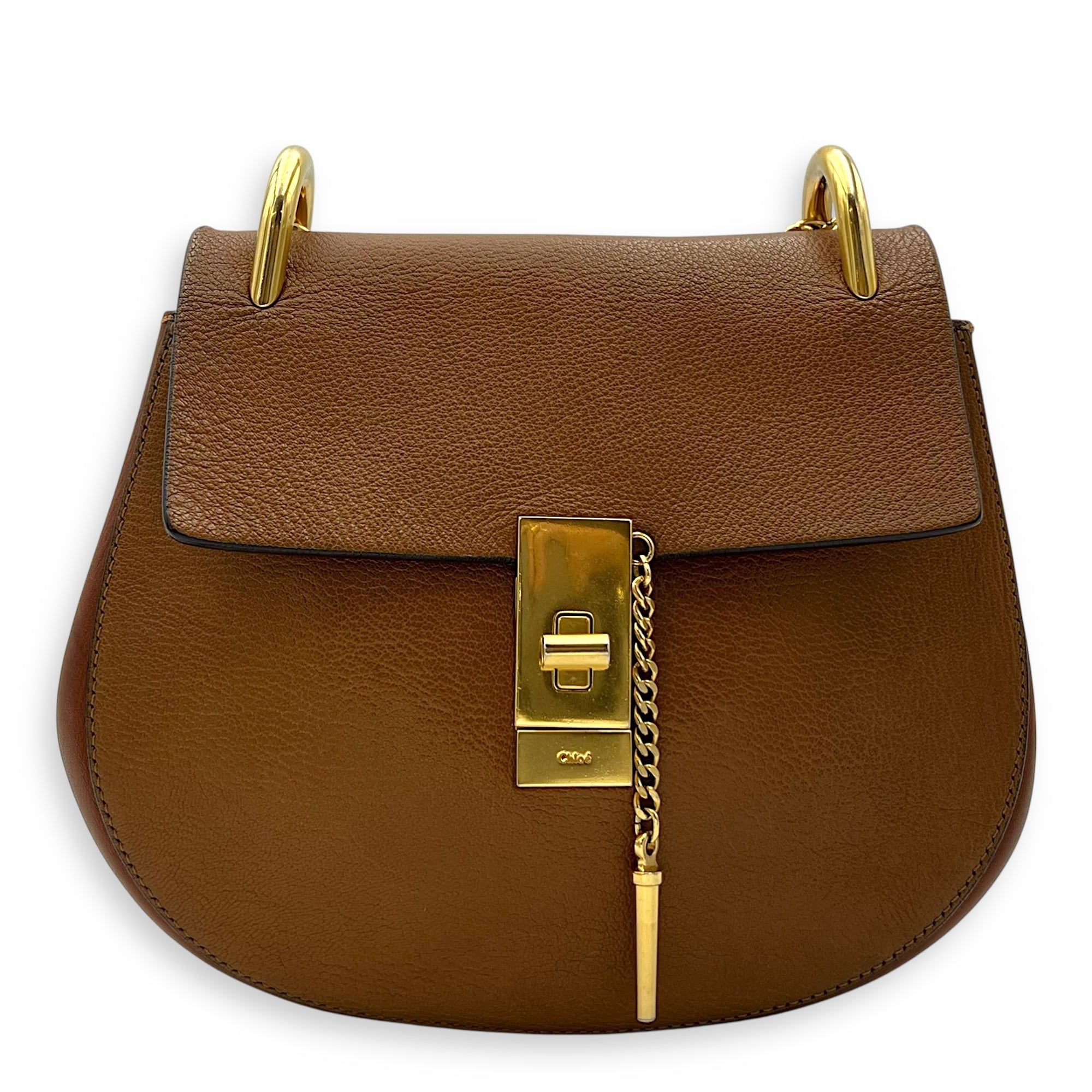 Chloé Drew Shoulder Bag Brown in Calfskin, Gold hardware (Category: Bags & Wallets) located in Singapore. Submitted by carousellluxury (Listing ID 1378630648, Image 1). Description: SKU S2506-006882AN Material Calfskin Color Brown Hardware Gold Strap Not IncludedDimension (L)23cm x (H)21cm x (W)7cm Accessories Series 01175665-2 Circa Est NA Microchipped FALSE PS: Available for Private-Viewing, Standard and Express delivery - Surface: Discolourati